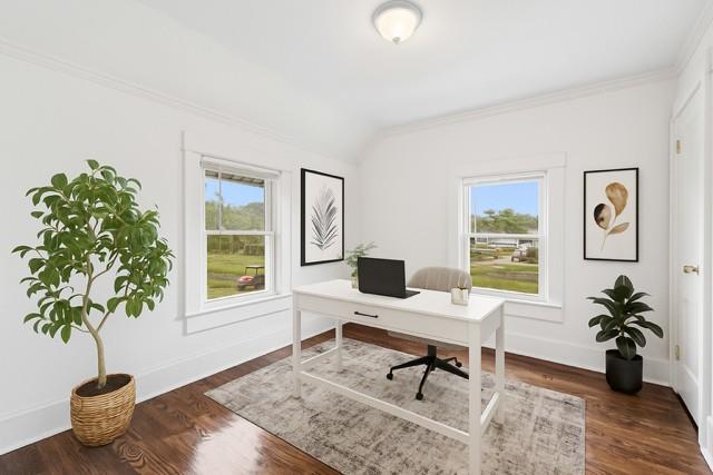401 Ocean Ave, Malverne, NY 11565 - home office with plenty of natural light, ornamental molding, wood finished floors, and lofted ceiling