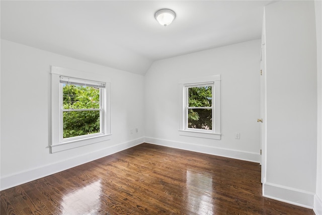 401 Ocean Ave, Malverne, NY 11565 - unfurnished room with plenty of natural light, lofted ceiling, and dark wood-style flooring