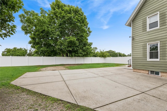 401 Ocean Ave, Malverne, NY 11565 - fenced backyard with a patio area