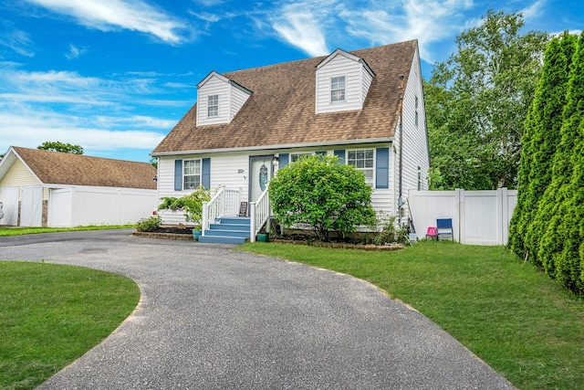 108A Union Ave, Lake Ronkonkoma, NY 11779 - new england style home featuring asphalt driveway and roof with shingles