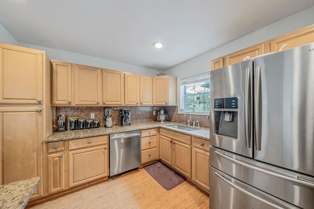 108A Union Ave, Lake Ronkonkoma, NY 11779 - kitchen featuring stainless steel appliances, light brown cabinets, light wood-style floors, backsplash, and light stone counters