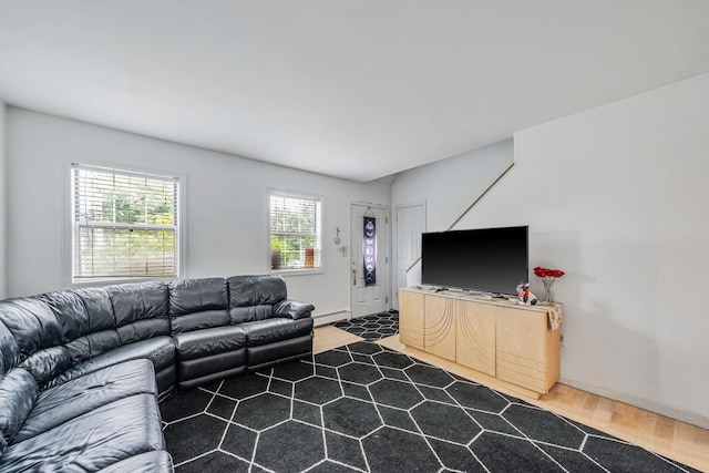 108A Union Ave, Lake Ronkonkoma, NY 11779 - living area featuring a baseboard heating unit and wood finished floors