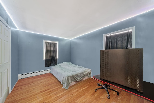 108A Union Ave, Lake Ronkonkoma, NY 11779 - bedroom featuring a baseboard radiator and wood finished floors