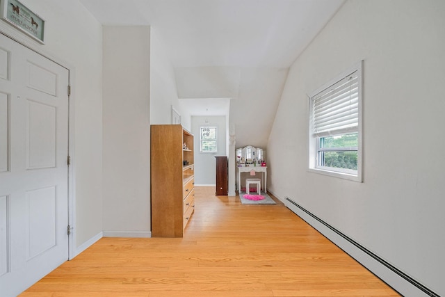 108A Union Ave, Lake Ronkonkoma, NY 11779 - hallway featuring baseboard heating, wood finished floors, and vaulted ceiling