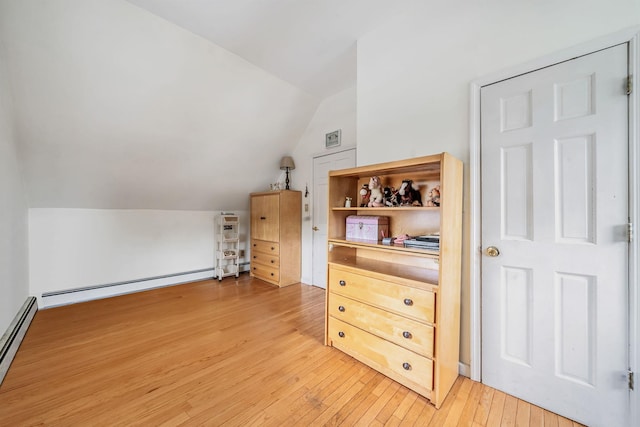 108A Union Ave, Lake Ronkonkoma, NY 11779 - additional living space featuring vaulted ceiling, light wood finished floors, and a baseboard radiator