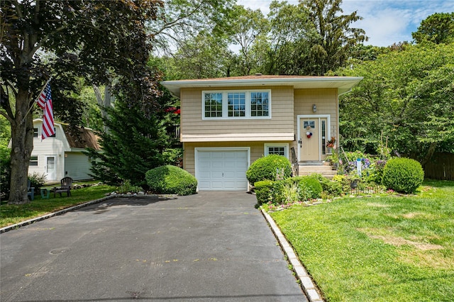 123 Lake St, Islip, NY 11751 - split foyer home with driveway, a front lawn, and an attached garage