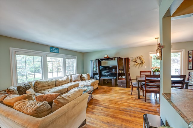 123 Lake St, Islip, NY 11751 - living area featuring light wood-style floors and a chandelier