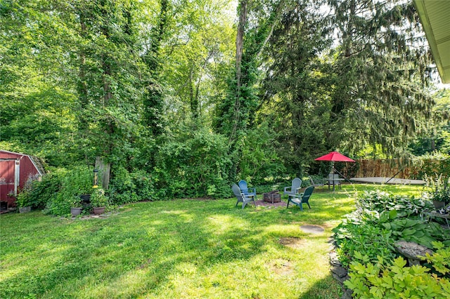 123 Lake St, Islip, NY 11751 - view of yard with a fire pit and a storage unit