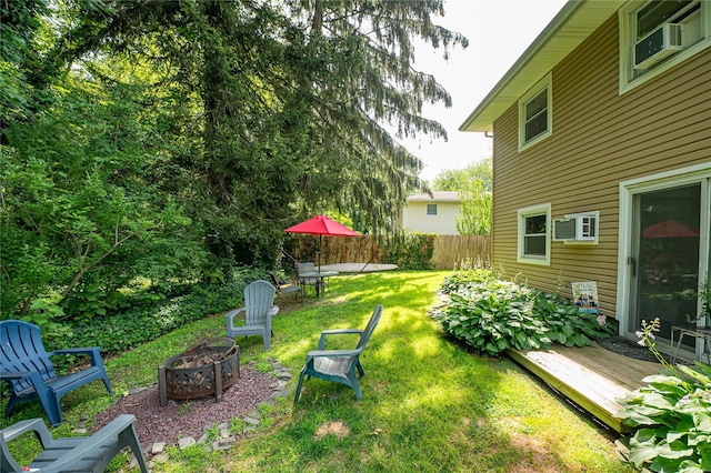 123 Lake St, Islip, NY 11751 - view of yard with an outdoor fire pit, a deck, and cooling unit
