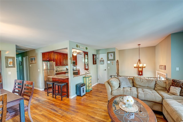 123 Lake St, Islip, NY 11751 - living area featuring a chandelier and light wood-type flooring