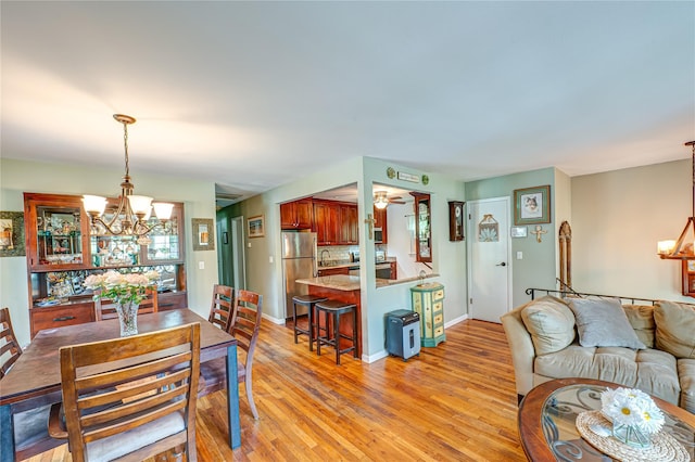 123 Lake St, Islip, NY 11751 - dining area with a chandelier and light wood finished floors