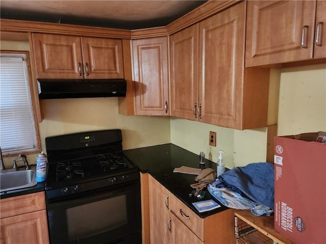 815 Swinton Ave, Bronx, NY 10465 - kitchen featuring gas stove, under cabinet range hood, and dark countertops