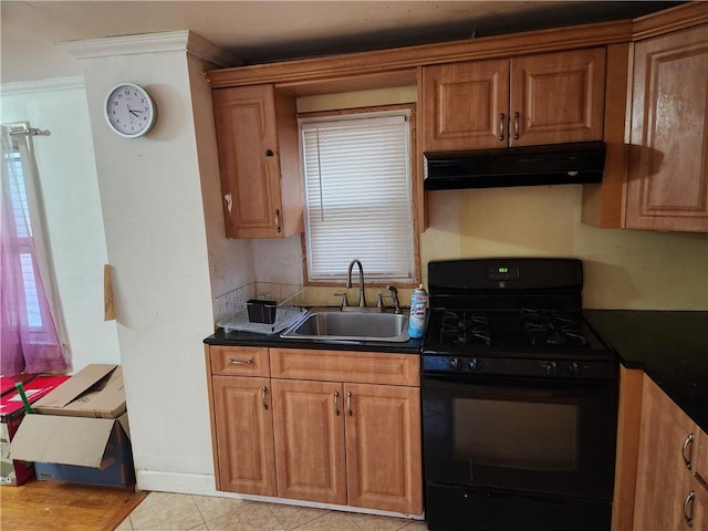 815 Swinton Ave, Bronx, NY 10465 - kitchen with black gas stove, under cabinet range hood, dark countertops, and brown cabinetry