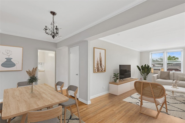 33-25 90th St Unit 3A, Jackson Heights, NY 11372 - dining space with light wood finished floors, a chandelier, and crown molding