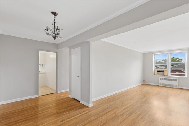 33-25 90th St Unit 3A, Jackson Heights, NY 11372 - unfurnished living room with radiator, a chandelier, crown molding, light wood finished floors, and cooling unit