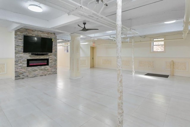 33-25 90th St Unit 3A, Jackson Heights, NY 11372 - basement featuring ceiling fan, a glass covered fireplace, and wainscoting