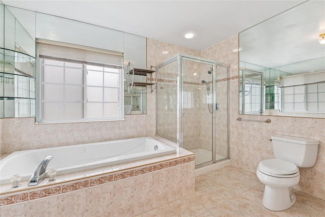 230 W Beech St, Long Beach, NY 11561 - bathroom with a garden tub, tile patterned flooring, a stall shower, and tile walls