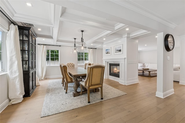 230 W Beech St, Long Beach, NY 11561 - dining space with light wood finished floors, ornamental molding, a glass covered fireplace, coffered ceiling, and beamed ceiling