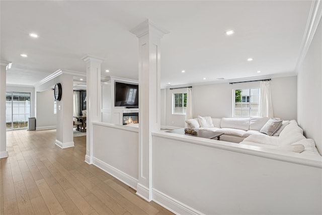 230 W Beech St, Long Beach, NY 11561 - living room featuring decorative columns, ornamental molding, recessed lighting, and wood finished floors