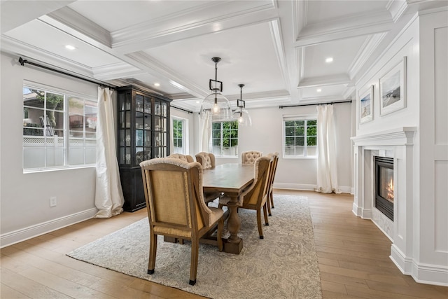 230 W Beech St, Long Beach, NY 11561 - dining area with coffered ceiling, ornamental molding, wood-type flooring, beam ceiling, and a glass covered fireplace