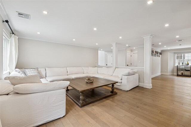 230 W Beech St, Long Beach, NY 11561 - living area featuring ornate columns, crown molding, light wood-type flooring, and recessed lighting