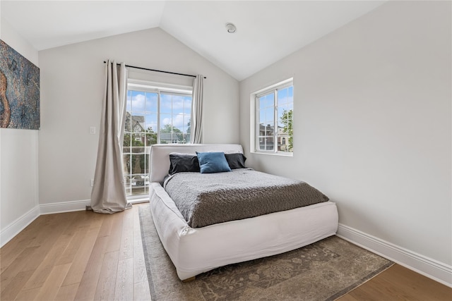 230 W Beech St, Long Beach, NY 11561 - bedroom with light wood-style flooring and vaulted ceiling