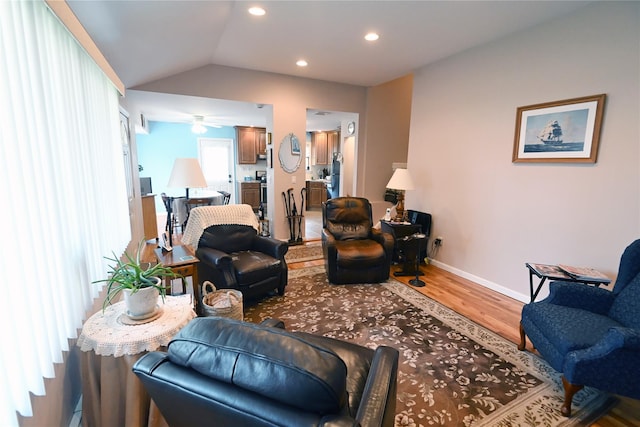 22 Victoria Rd, North Babylon, NY 11703 - living room featuring wood finished floors, lofted ceiling, a ceiling fan, and recessed lighting