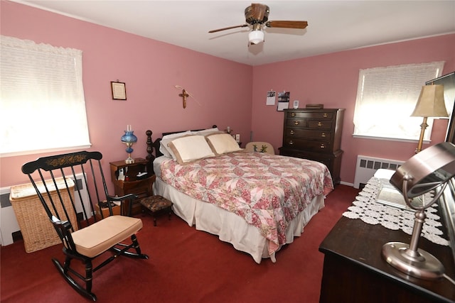 22 Victoria Rd, North Babylon, NY 11703 - carpeted bedroom with radiator and a ceiling fan