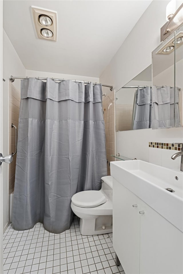 425 Shore Rd Unit 1A, Long Beach, NY 11561 - full bath featuring tile patterned flooring, vanity, decorative backsplash, and shower / tub combo