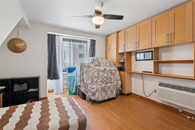 425 Shore Rd Unit 1A, Long Beach, NY 11561 - bedroom featuring light wood-type flooring, a ceiling fan, and a wall mounted AC