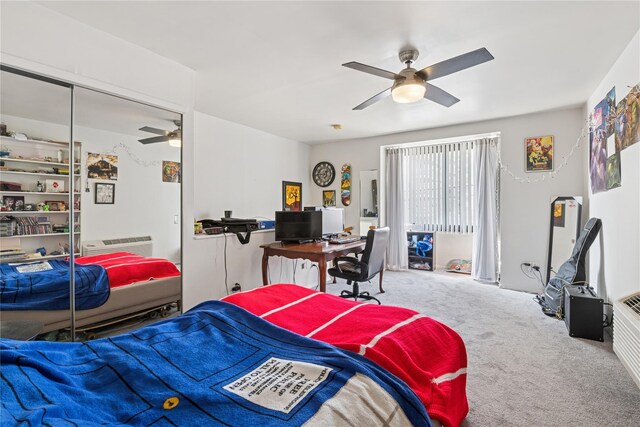 425 Shore Rd Unit 1A, Long Beach, NY 11561 - carpeted bedroom with a desk, a ceiling fan, and an AC wall unit