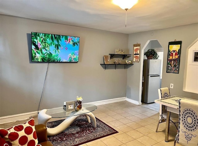 687 E 42nd St, Brooklyn, NY 11203 - living room featuring light tile patterned flooring and baseboards