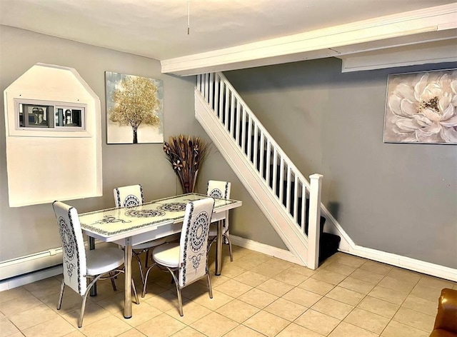 687 E 42nd St, Brooklyn, NY 11203 - tiled dining area featuring stairs and a baseboard radiator