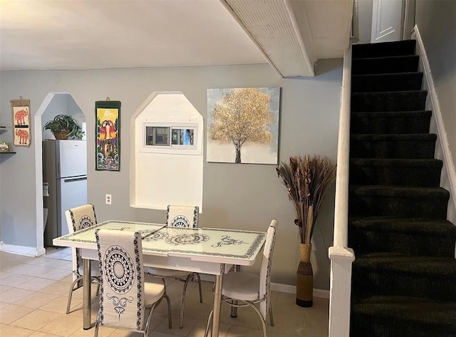 687 E 42nd St, Brooklyn, NY 11203 - dining area featuring light tile patterned floors and stairway