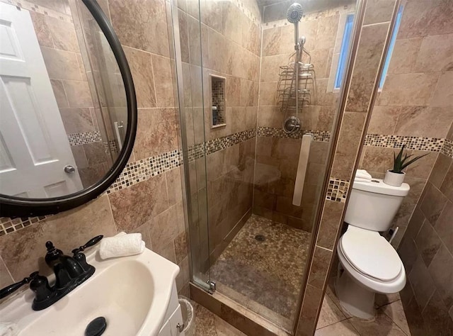 687 E 42nd St, Brooklyn, NY 11203 - bathroom with tile walls, a stall shower, vanity, and tasteful backsplash