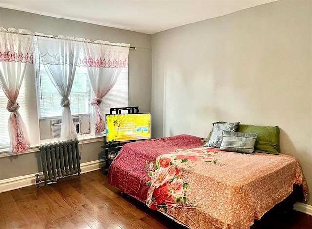 687 E 42nd St, Brooklyn, NY 11203 - bedroom featuring radiator and wood finished floors