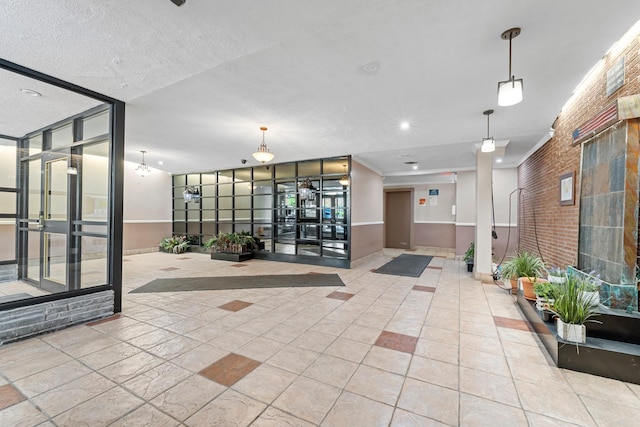 68-20 Selfridge St Unit 6H, Forest Hills, NY 11375 - community lobby featuring brick wall and recessed lighting