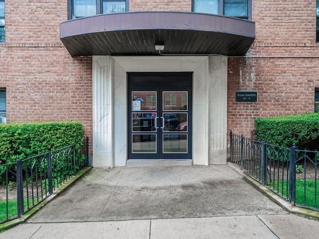 102-12 65th Ave Unit D22, Forest Hills, NY 11375 - doorway to property featuring french doors and brick siding