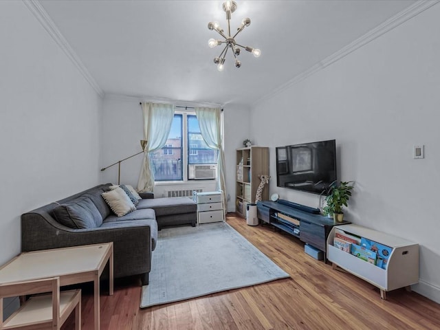 102-12 65th Ave Unit D22, Forest Hills, NY 11375 - living area featuring ornamental molding, a chandelier, wood finished floors, cooling unit, and radiator heating unit
