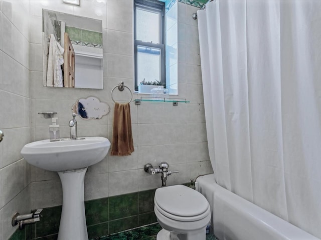 102-12 65th Ave Unit D22, Forest Hills, NY 11375 - bathroom featuring tile walls and shower / tub combo with curtain