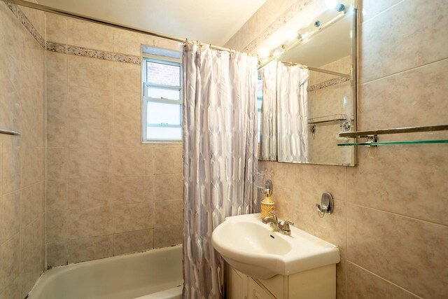 62-59 108th St Unit 4N, Forest Hills, NY 11375 - bathroom featuring shower / bath combo with shower curtain and vanity