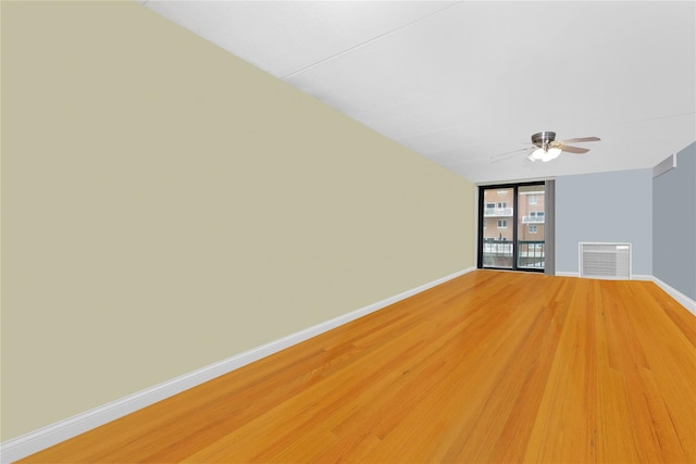 750 Broadway W Unit 3M, Long Beach, NY 11561 - unfurnished room featuring a ceiling fan, light wood finished floors, and floor to ceiling windows