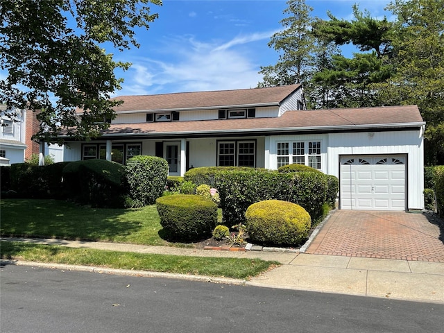 55 Laurel Dr, Massapequa Park, NY 11762 - traditional home with a garage and decorative driveway