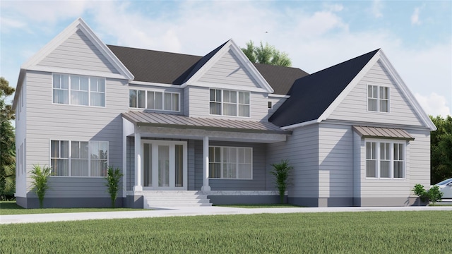 34 Old Main Rd, Quogue, NY 11959 - view of front of house with a standing seam roof, a metal roof, and a front lawn