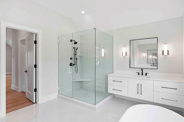 34 Old Main Rd, Quogue, NY 11959 - bathroom with a stall shower, vanity, a freestanding tub, and tile patterned flooring