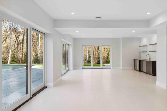 34 Old Main Rd, Quogue, NY 11959 - unfurnished living room with healthy amount of natural light and recessed lighting