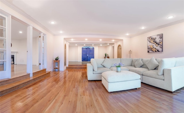 530 S Centre Island Rd, Centre Island, NY 11771 - living room featuring recessed lighting, ornamental molding, light wood finished floors, and a fireplace