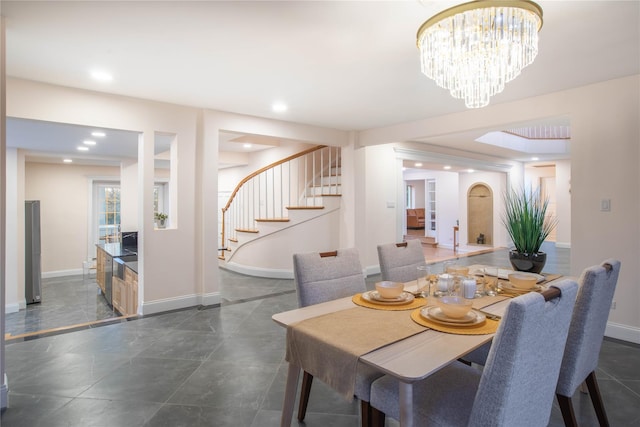 530 S Centre Island Rd, Centre Island, NY 11771 - dining room featuring stairs, a chandelier, recessed lighting, and arched walkways