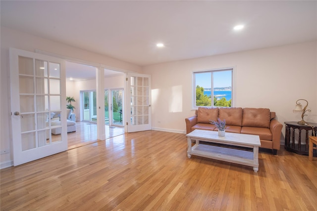 530 S Centre Island Rd, Centre Island, NY 11771 - living area with french doors, light wood finished floors, and recessed lighting