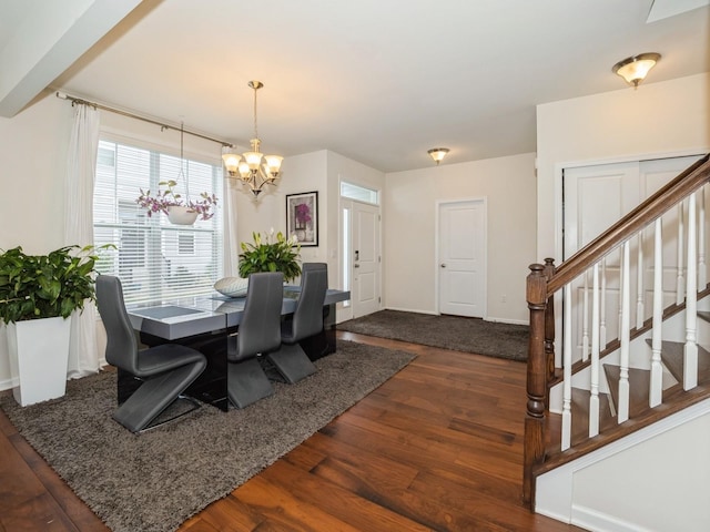 57 Lewis Rd, Hopewell Junction, NY 12533 - dining area featuring dark wood-style flooring, a chandelier, and stairs